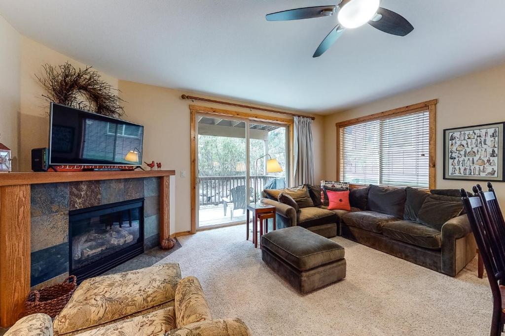 a living room with a couch and a fireplace at Comfortable and Convenient Truckee Condo in Truckee