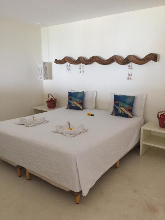 Giường trong phòng chung tại Lar do Mar - Sabrina U07 - Cond. Pipa Privillege