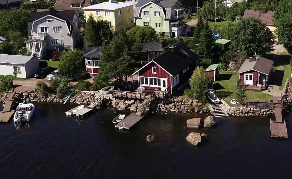an aerial view of a river with houses and a dock at Rantakari Cottage in Kotka