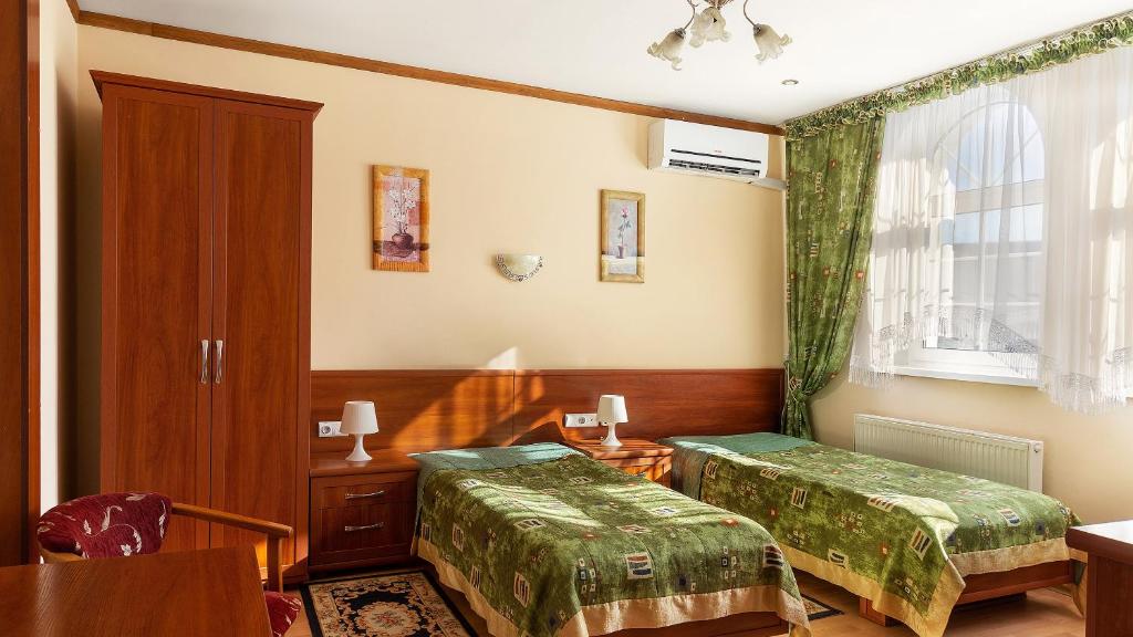 Postel nebo postele na pokoji v ubytování Villa Marta