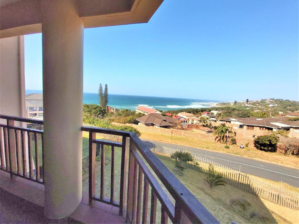 a balcony with a view of the ocean at Kuta Beach Unit 12 in Margate