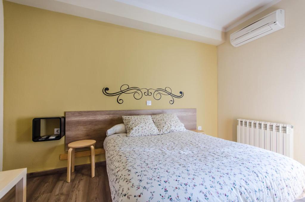 Posteľ alebo postele v izbe v ubytovaní Hostal La Pastora