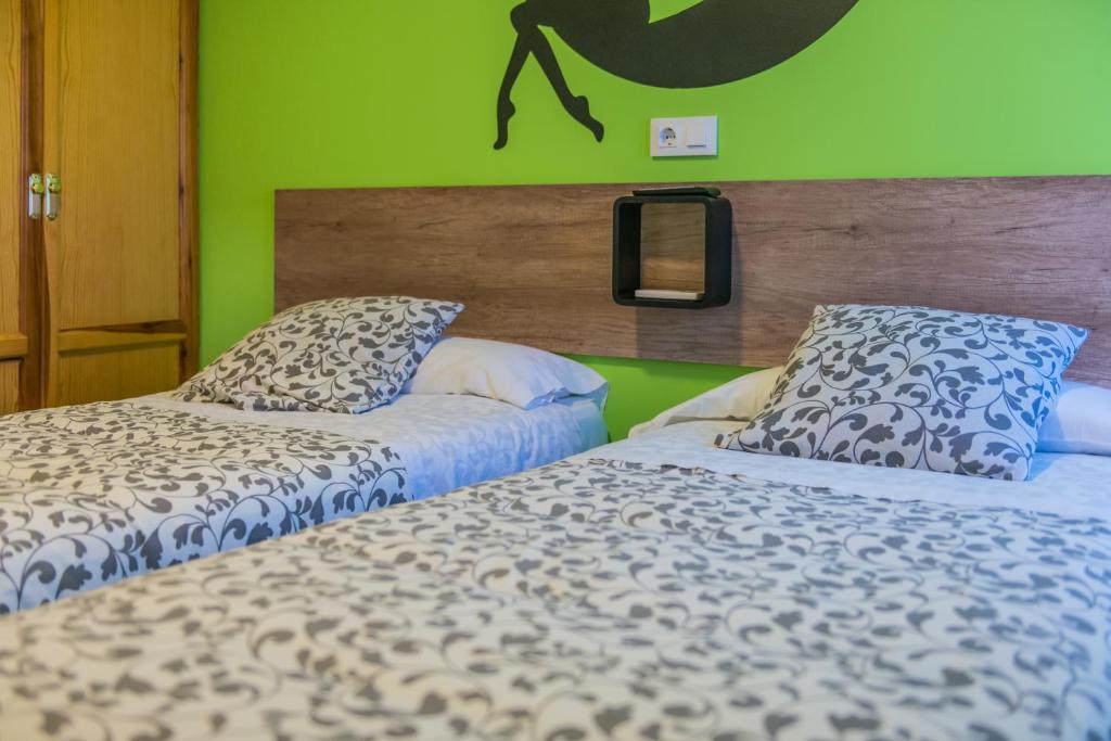 Posteľ alebo postele v izbe v ubytovaní Hostal La Pastora