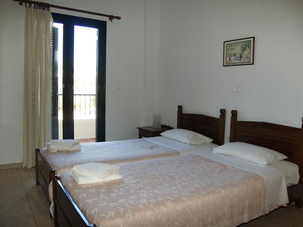 Postel nebo postele na pokoji v ubytování Irida Apartments -EX BLAZIS HOUSE