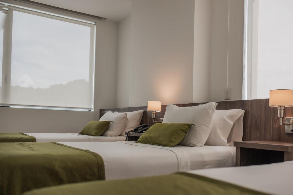 Postel nebo postele na pokoji v ubytování Hotel Santiago de Arma