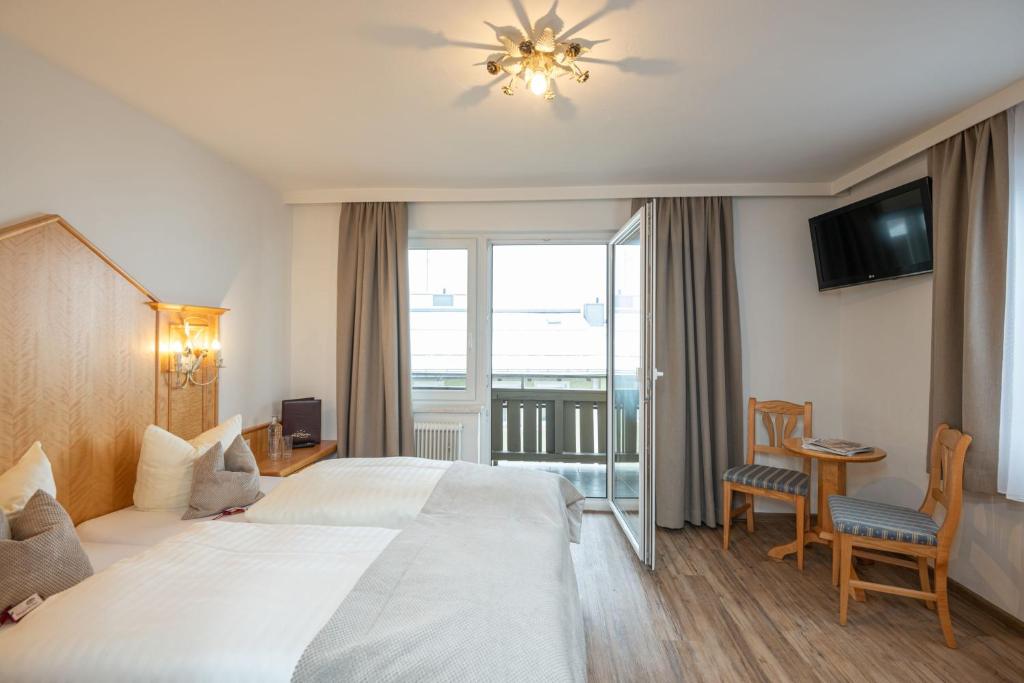 Postel nebo postele na pokoji v ubytování Hotel Stegerbräu