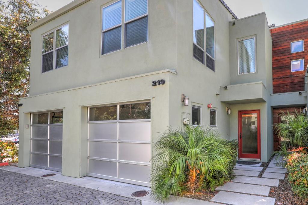 a house with white garage doors on a street at 219 San Miguel in Avila Beach