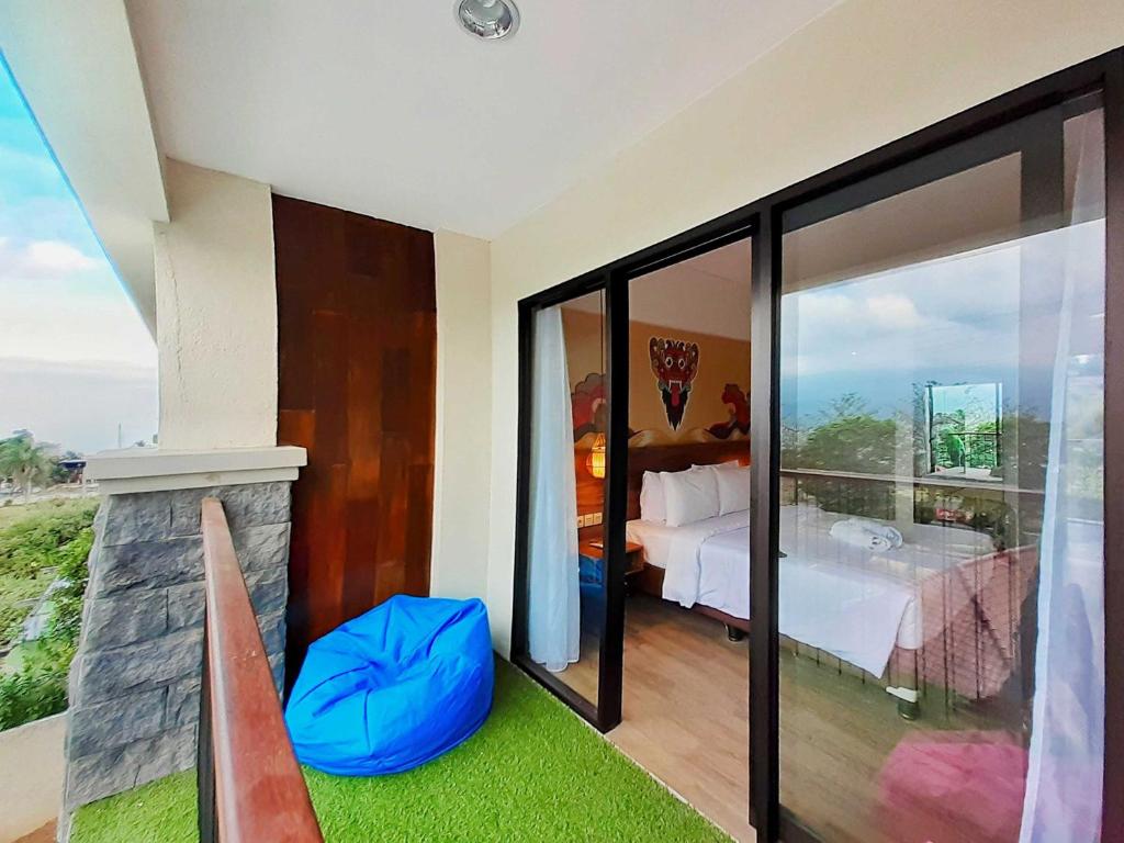 Postel nebo postele na pokoji v ubytování The Batu Hotel & Villas