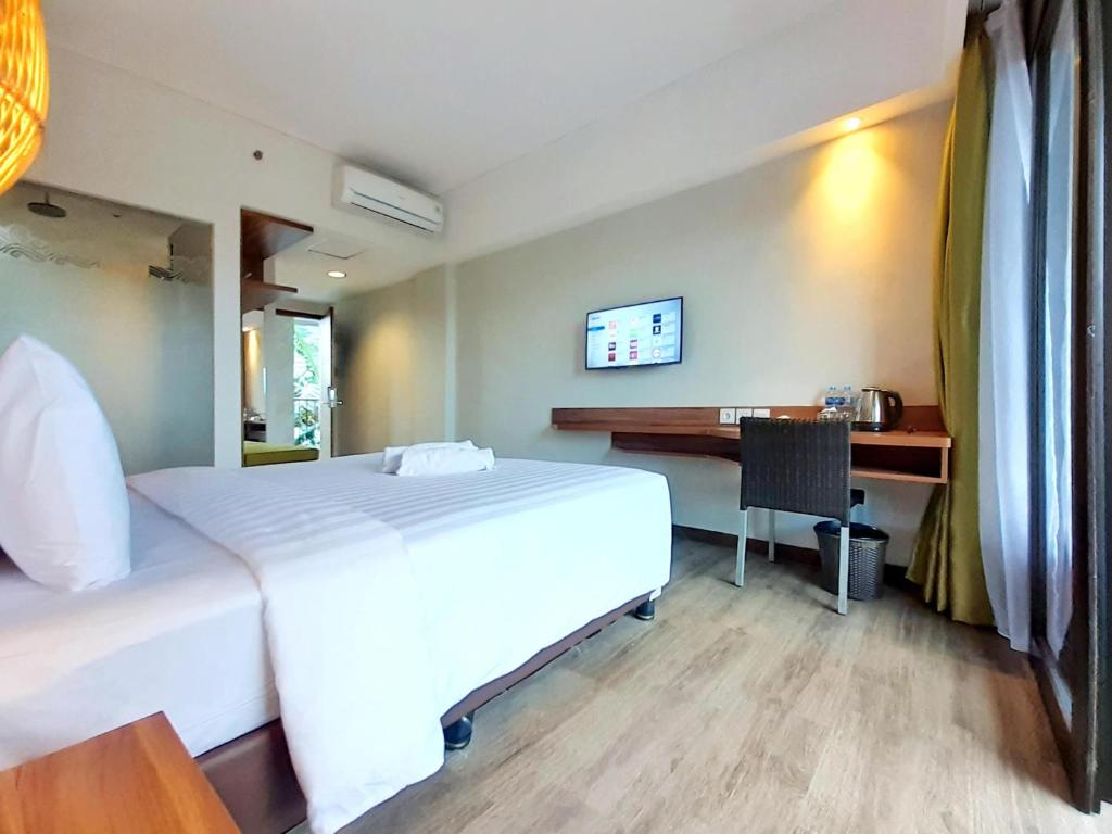 TV a/nebo společenská místnost v ubytování The Batu Hotel & Villas