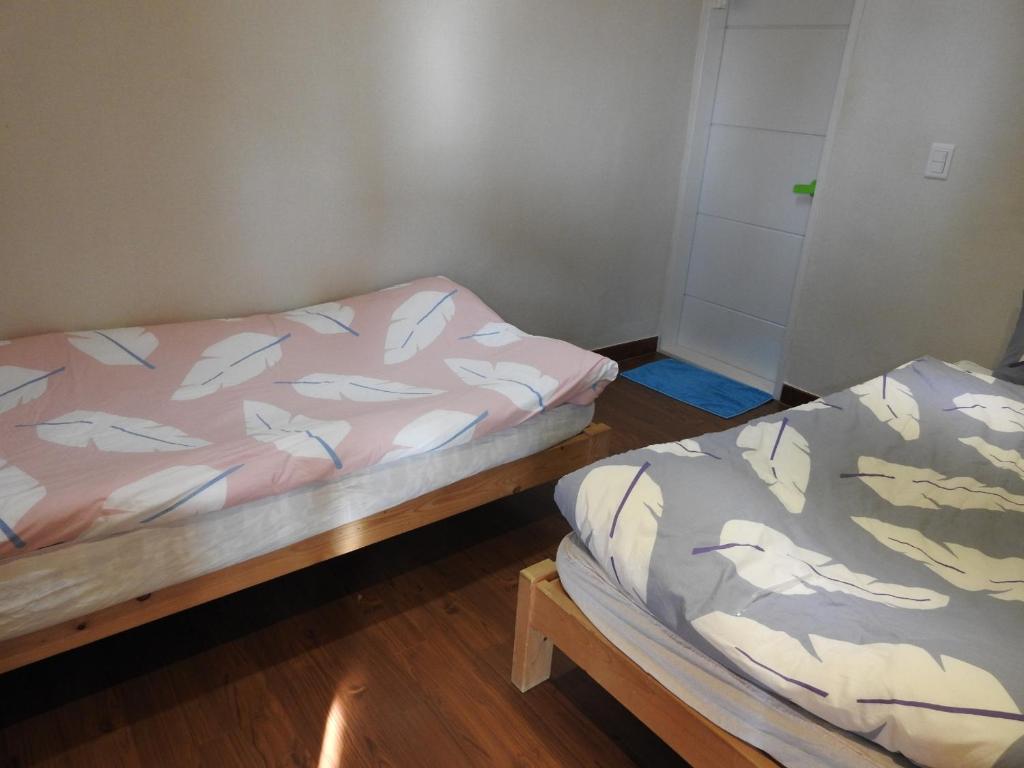 Postel nebo postele na pokoji v ubytování Dorandoran Guesthouse