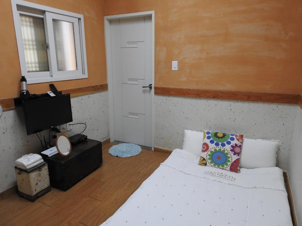 Postel nebo postele na pokoji v ubytování Dorandoran Guesthouse