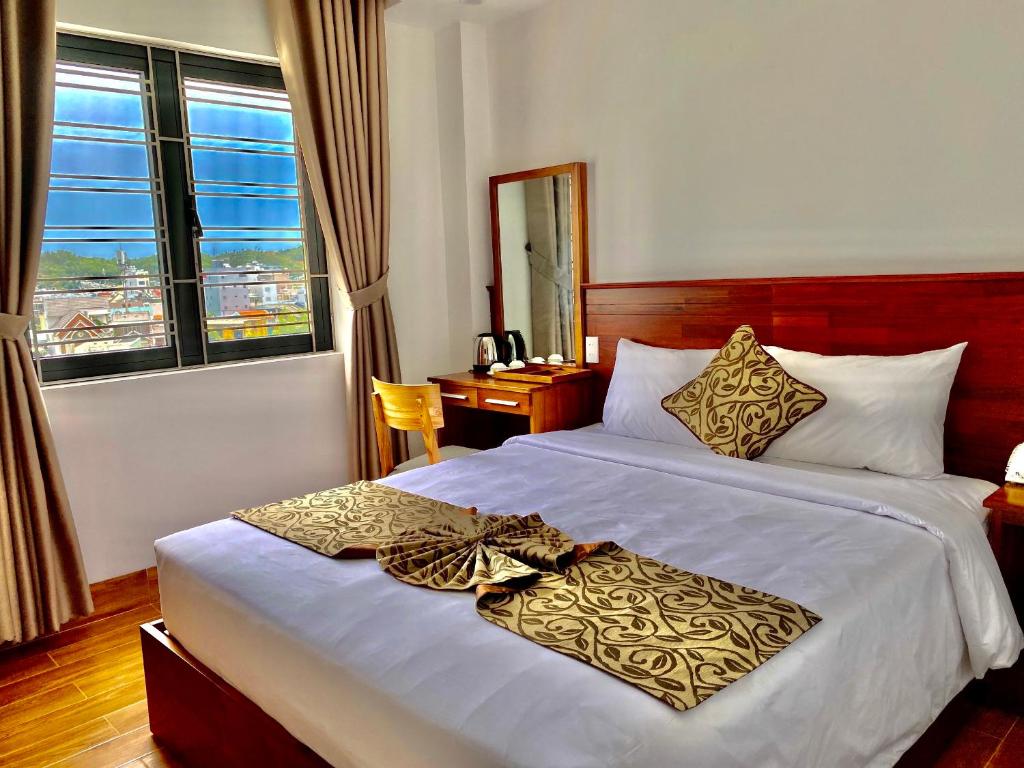 Giường trong phòng chung tại Ocean View Quy Nhon Hotel