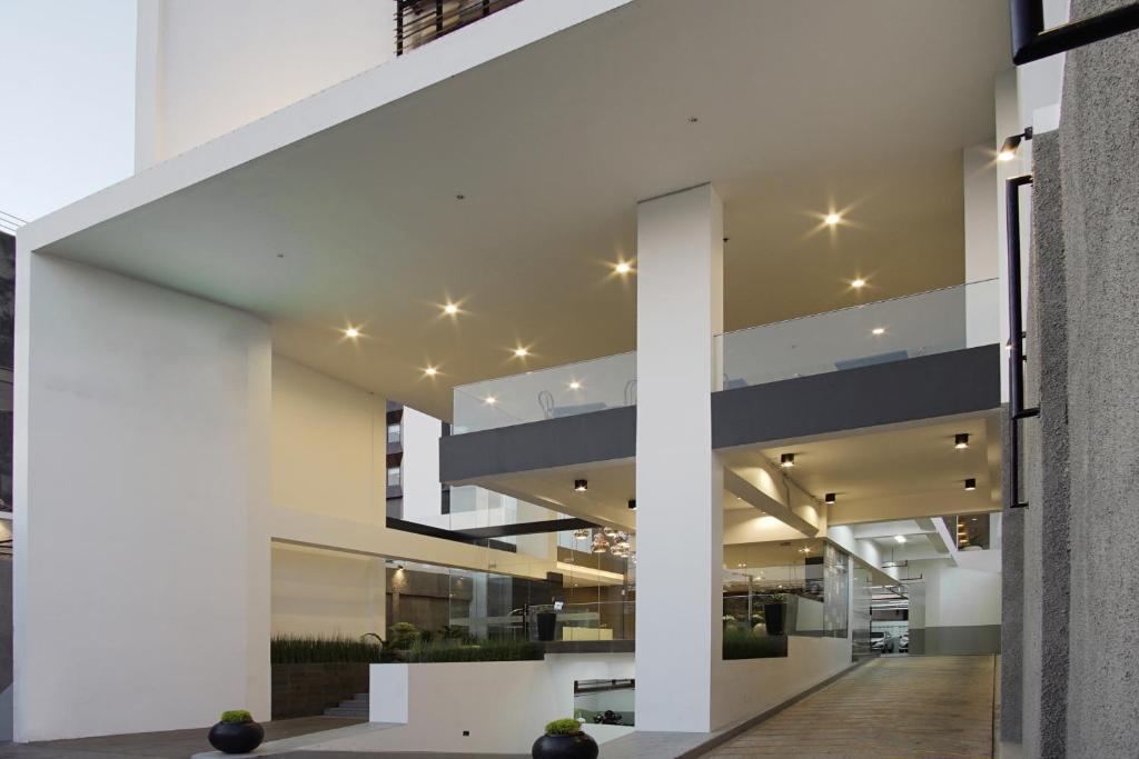 a modern house with white walls and ceilings at Malioboro Prime Hotel in Yogyakarta