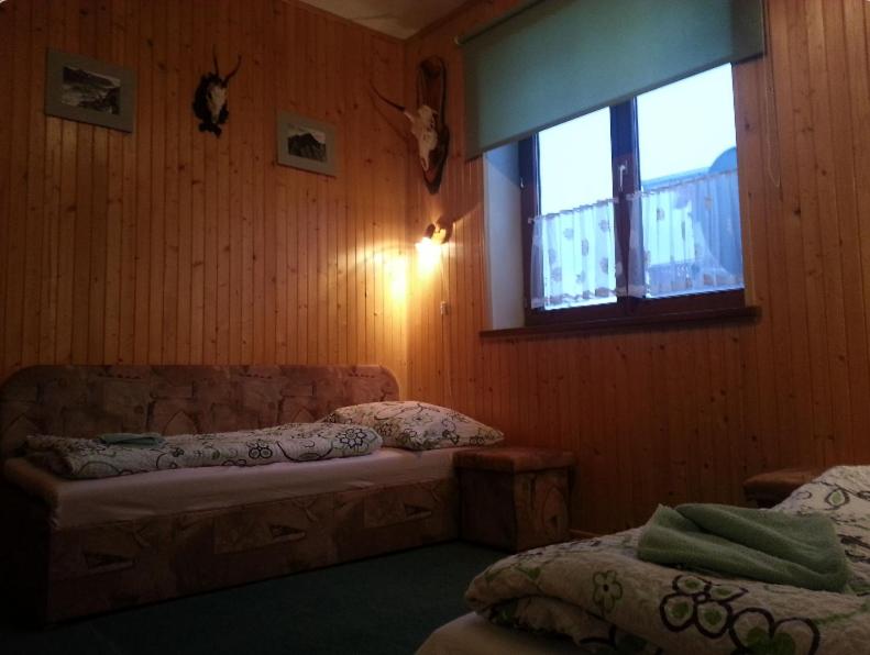 Postel nebo postele na pokoji v ubytování Rodinný penzion Ždiaran