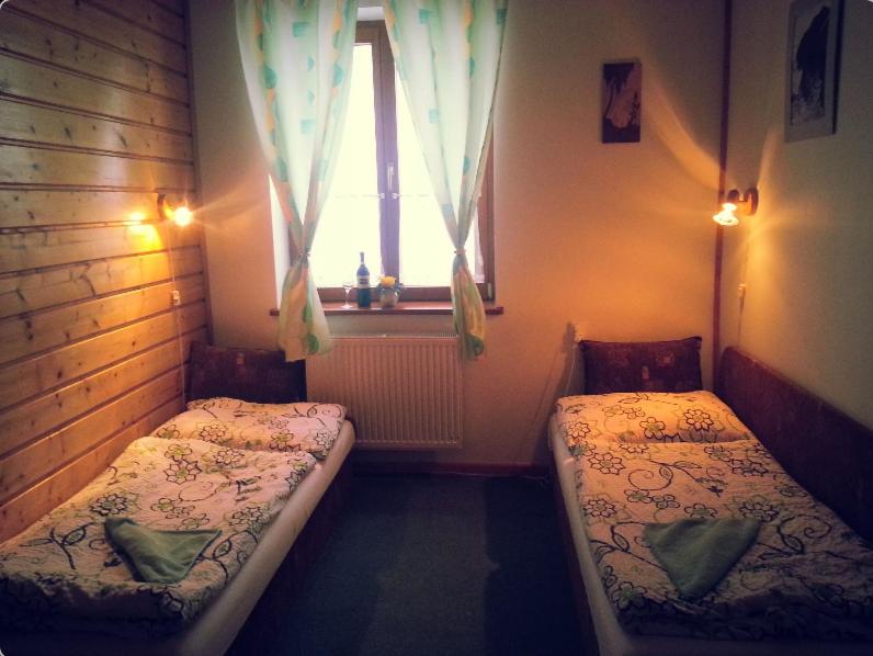 Postel nebo postele na pokoji v ubytování Rodinný penzion Ždiaran