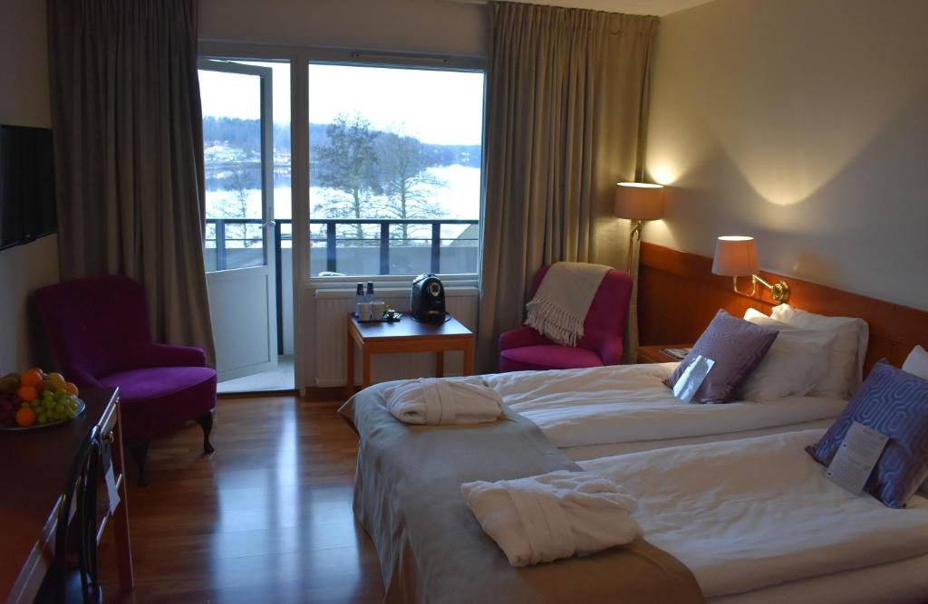Postel nebo postele na pokoji v ubytování First Hotel Bengtsfors