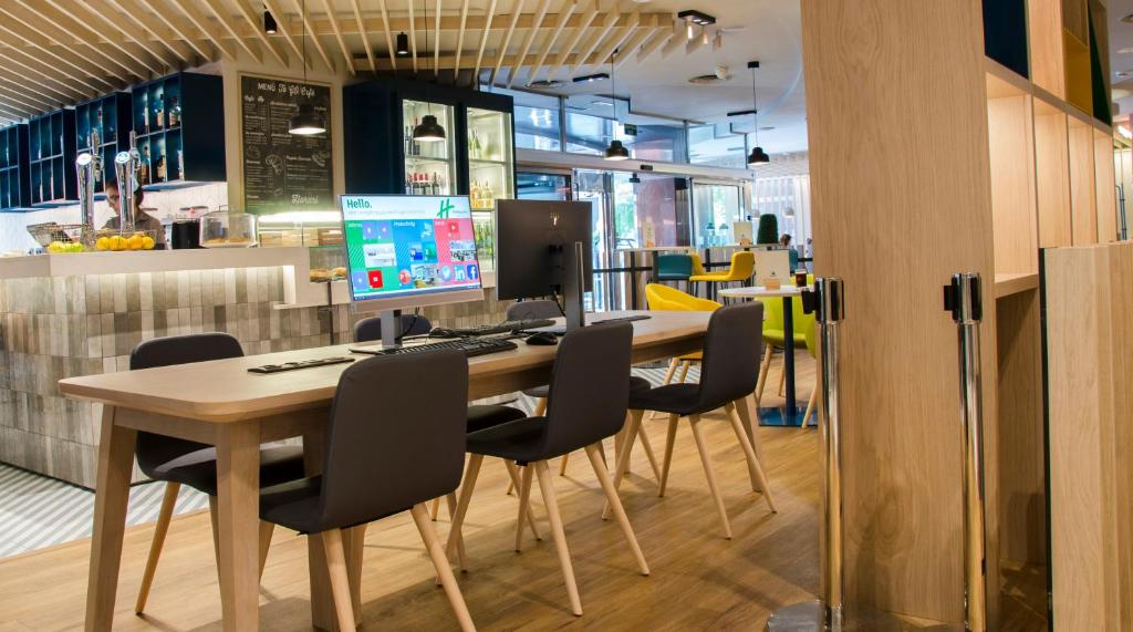 TV a/nebo společenská místnost v ubytování Suites Plaza Hotel & Wellness