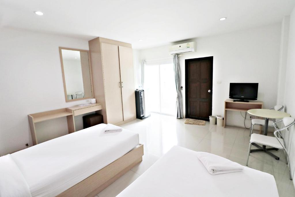 Postel nebo postele na pokoji v ubytování Hua Hin Irooms