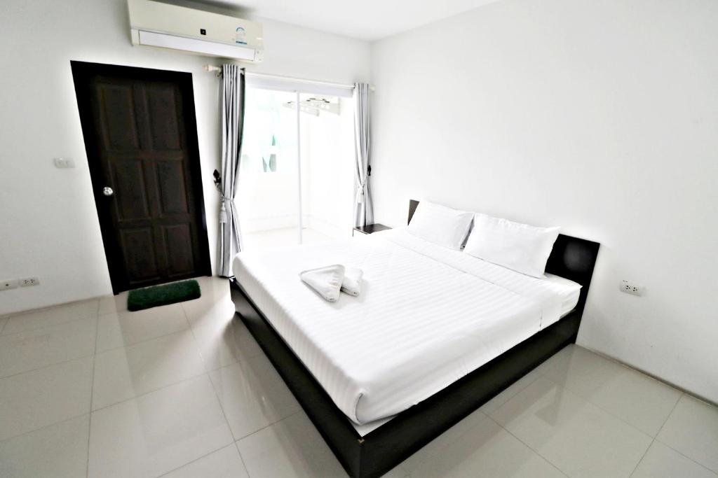 Postel nebo postele na pokoji v ubytování Hua Hin Irooms