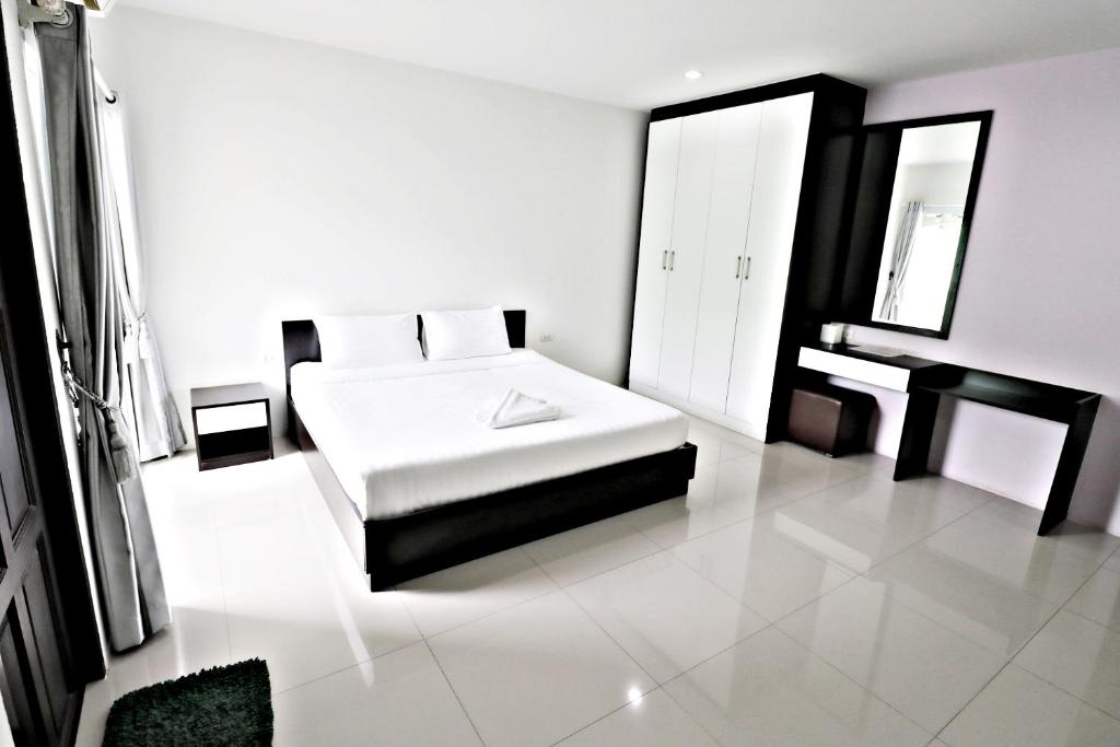 Postel nebo postele na pokoji v ubytování Hua Hin Irooms