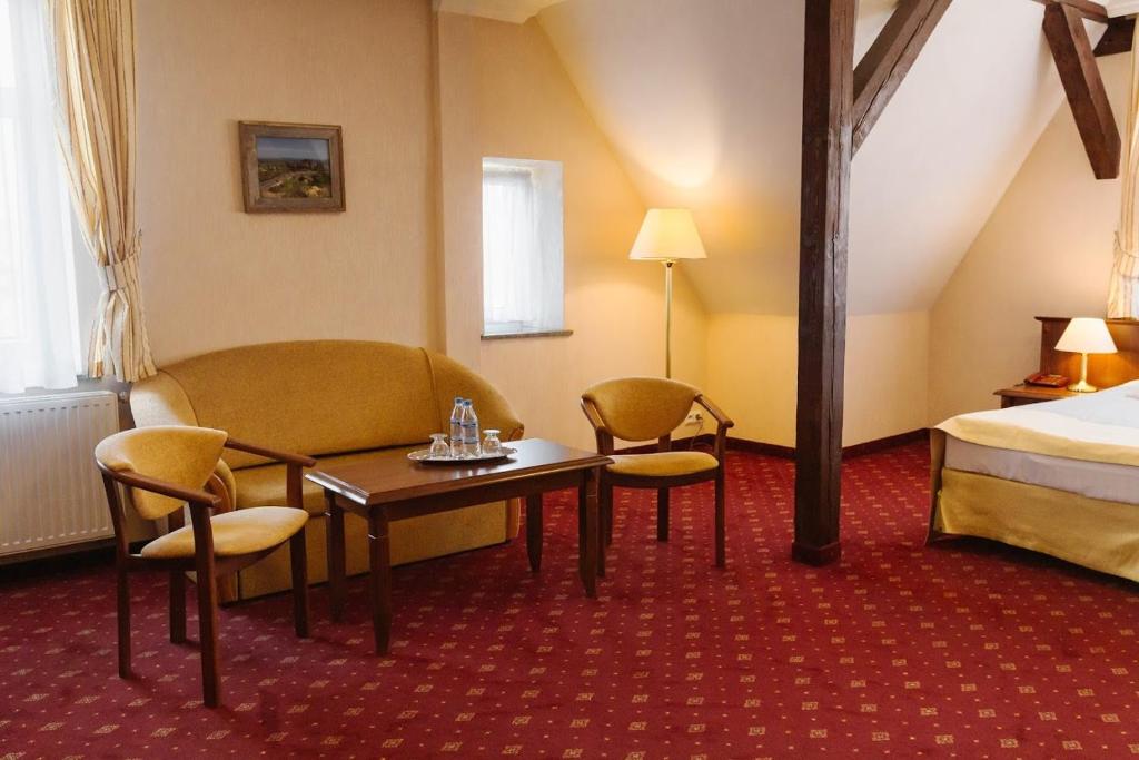 Posteľ alebo postele v izbe v ubytovaní Hotel Jakub Sobieski