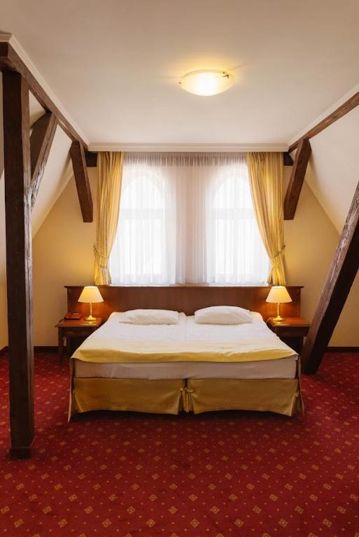 Posteľ alebo postele v izbe v ubytovaní Hotel Jakub Sobieski