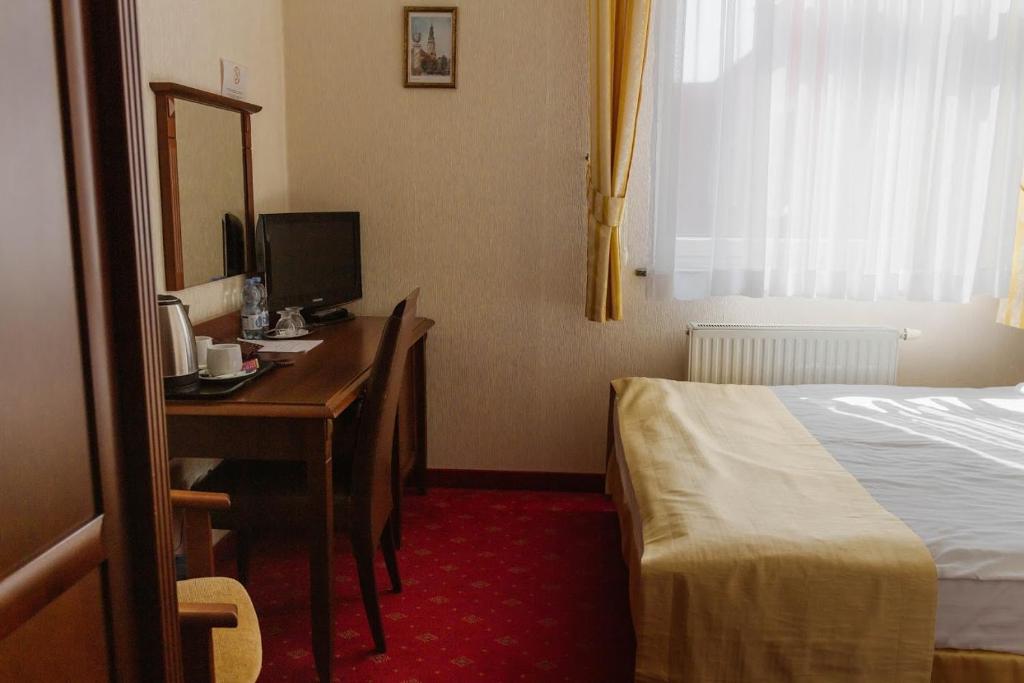 Posteľ alebo postele v izbe v ubytovaní Hotel Jakub Sobieski