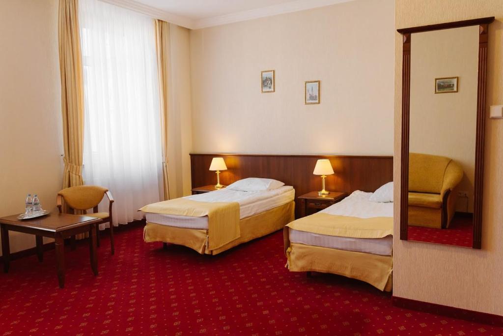 Posteľ alebo postele v izbe v ubytovaní Hotel Jakub Sobieski