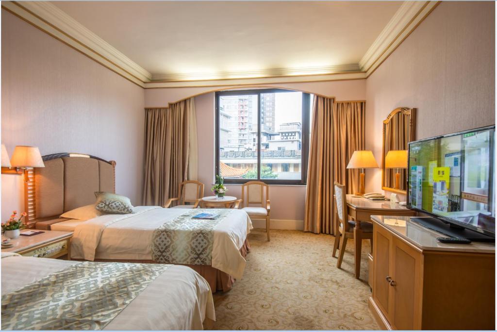 TV a/nebo společenská místnost v ubytování Panyu Hotel