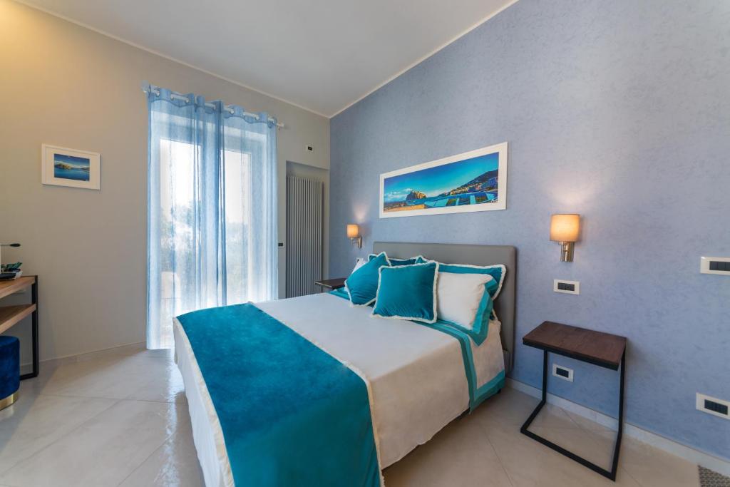 Posteľ alebo postele v izbe v ubytovaní B&B La Piazzetta