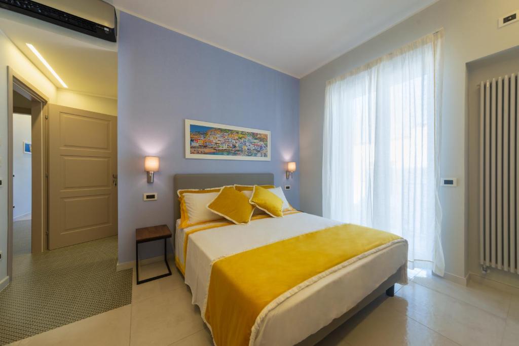 Posteľ alebo postele v izbe v ubytovaní B&B La Piazzetta
