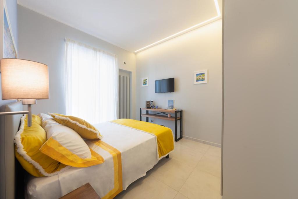 Posteľ alebo postele v izbe v ubytovaní B&B La Piazzetta