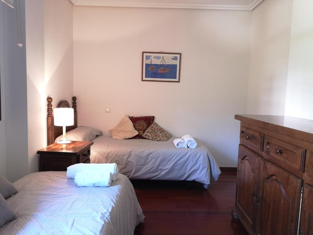 Posteľ alebo postele v izbe v ubytovaní Apartamento Ruiloba