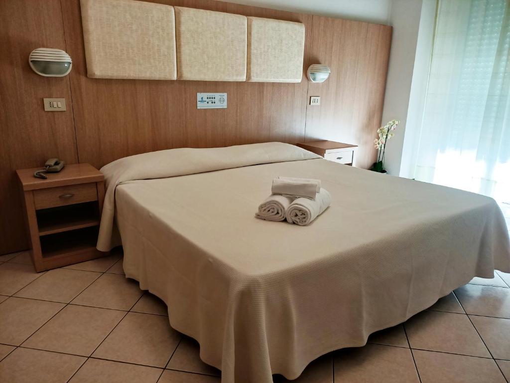 Postel nebo postele na pokoji v ubytování Hotel Cormoran