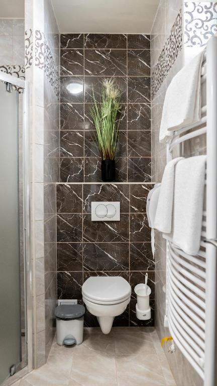 Koupelna v ubytování Főnix Apartman