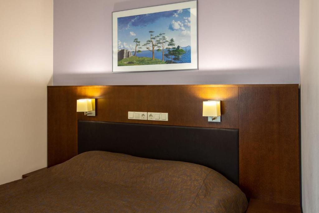 Letto o letti in una camera di Viiking Spa Hotel
