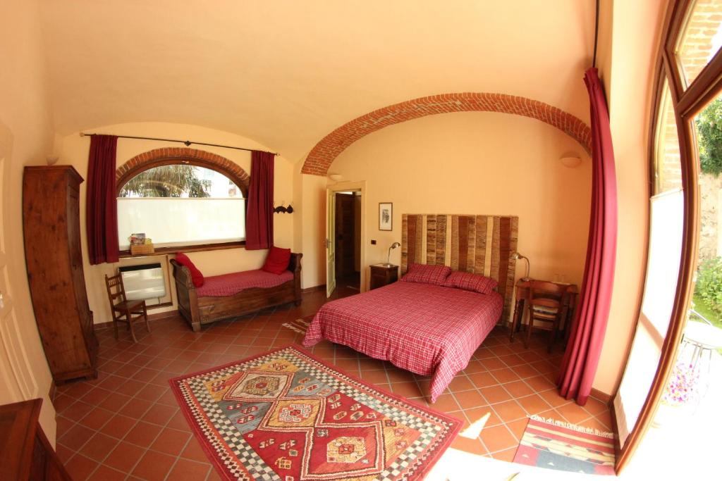 Postel nebo postele na pokoji v ubytování B&B Cascina Moncrava