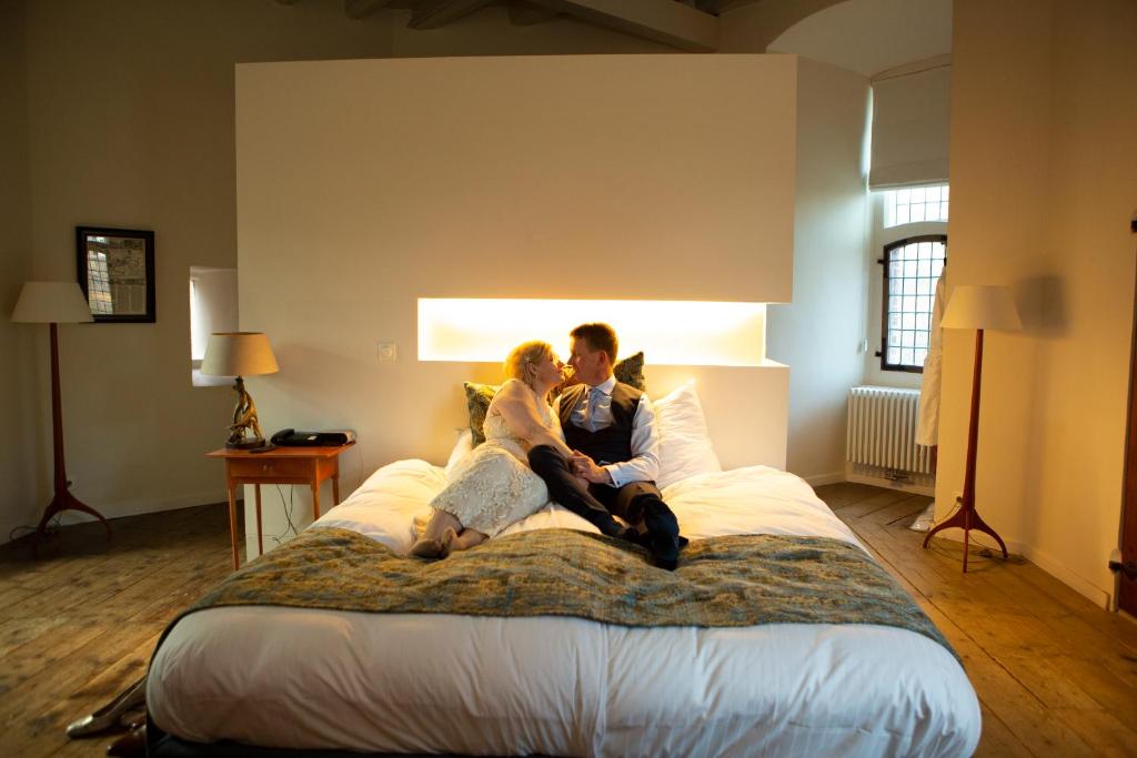Postel nebo postele na pokoji v ubytování Kasteel Huis Bergh