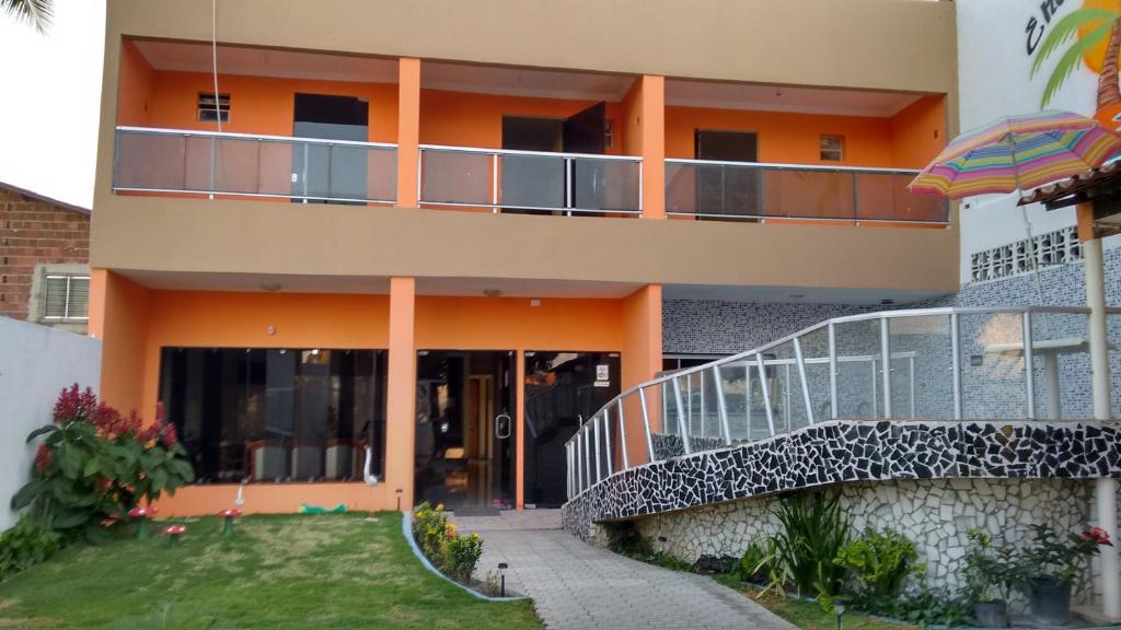 an external view of a building with a balcony at Casa em Ponta De Pedras- Encanto do Litoral! in Recife