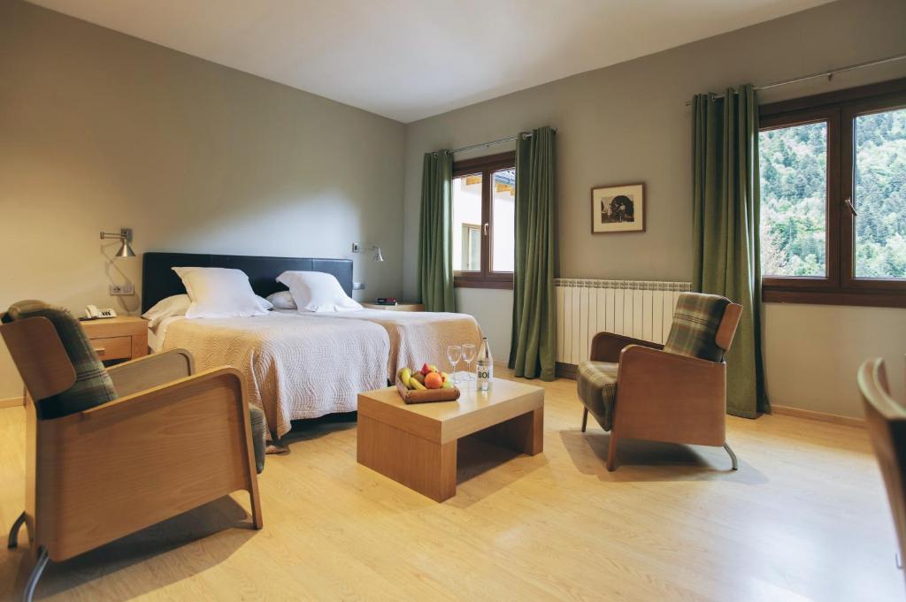 Postel nebo postele na pokoji v ubytování Hotel Manantial