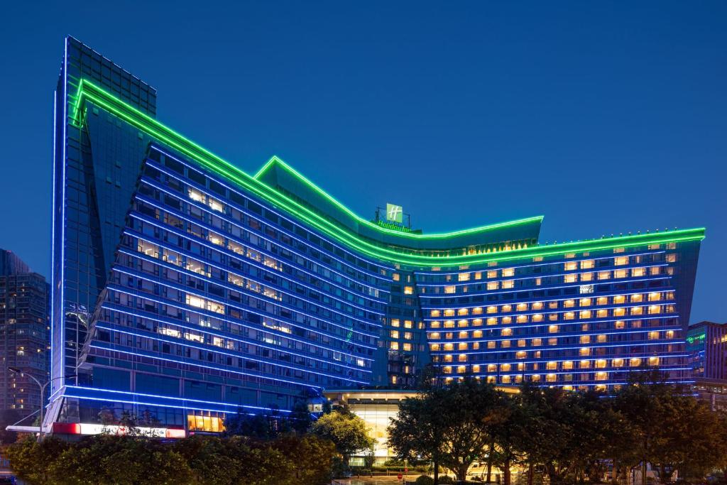 a large building with green lights on it at Holiday Inn Chengdu Century City West, an IHG Hotel in Chengdu