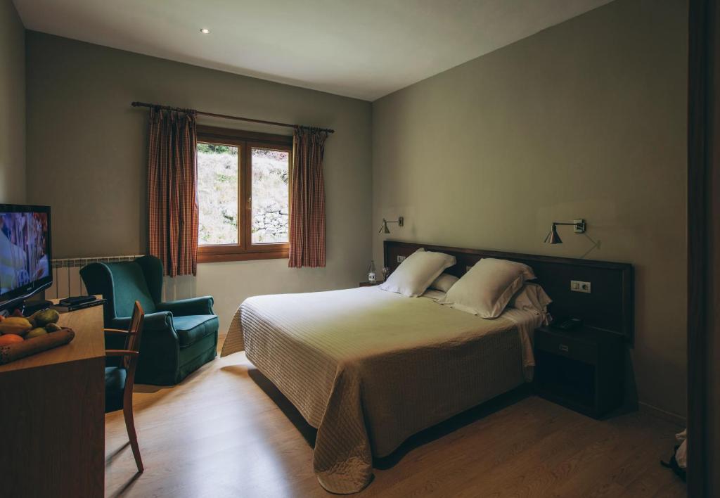 Postel nebo postele na pokoji v ubytování Hotel Manantial