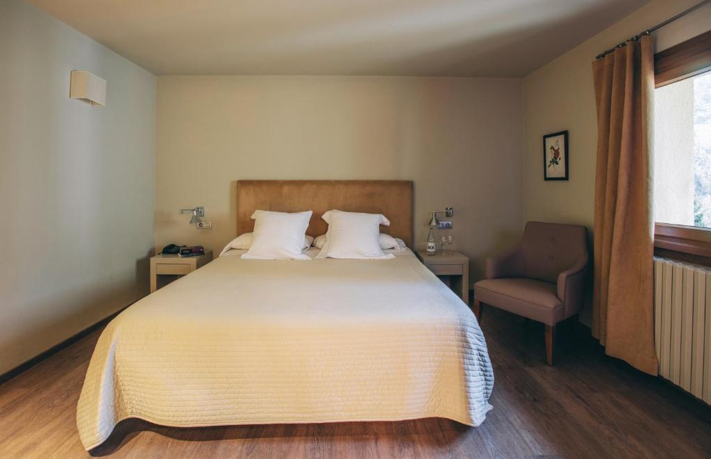 Postel nebo postele na pokoji v ubytování Hotel Manantial