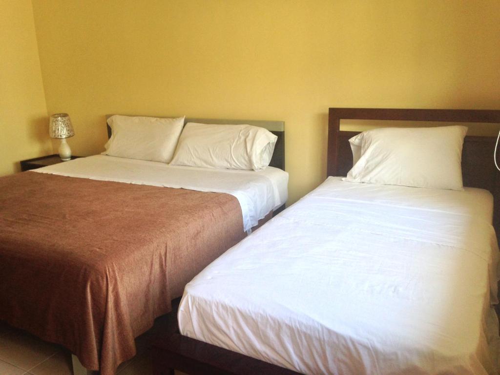 Postel nebo postele na pokoji v ubytování Casa y Mar Hotel