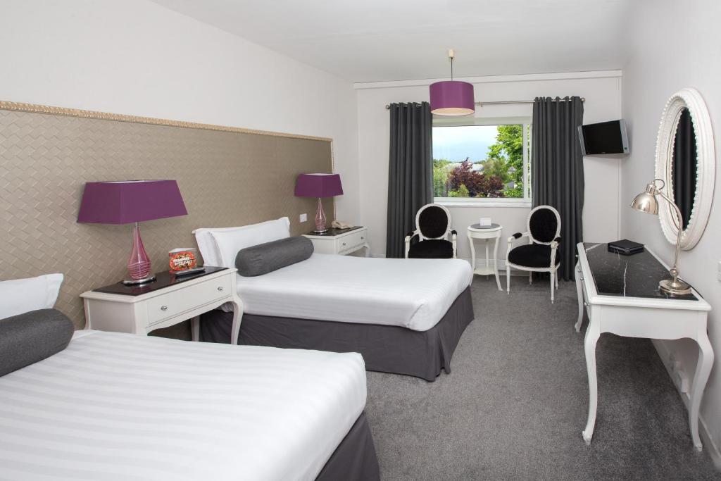 Postel nebo postele na pokoji v ubytování Hotel Kilkenny