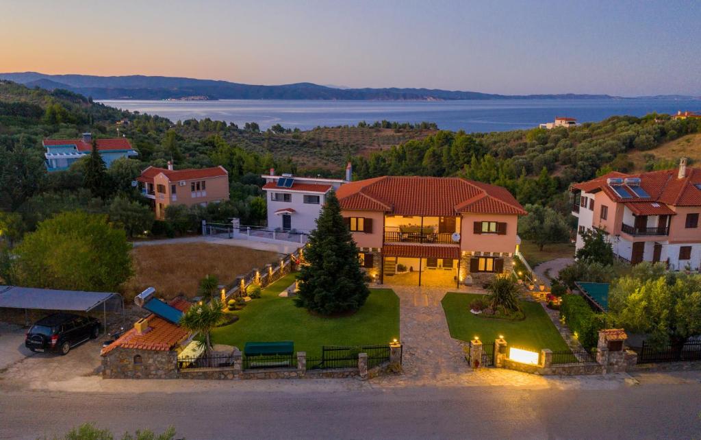 an aerial view of a house with a lake at Xalonia Seaview in Agios Nikolaos