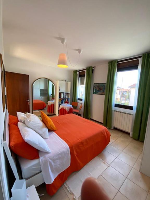 A bed or beds in a room at GARDEN OF VENICE