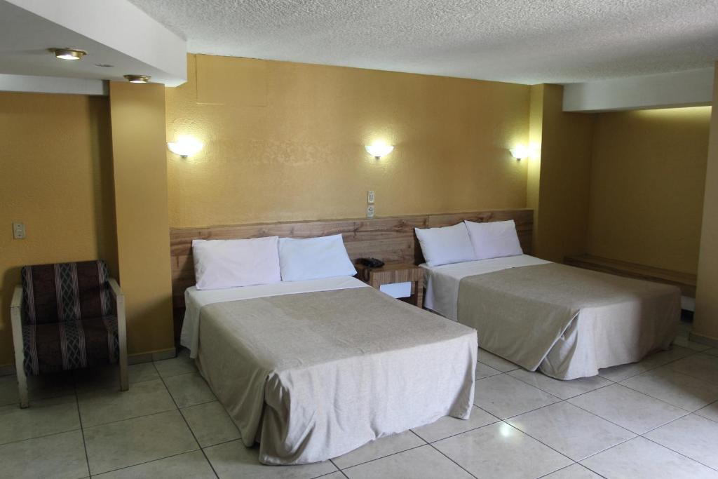 Postel nebo postele na pokoji v ubytování Hotel Universo