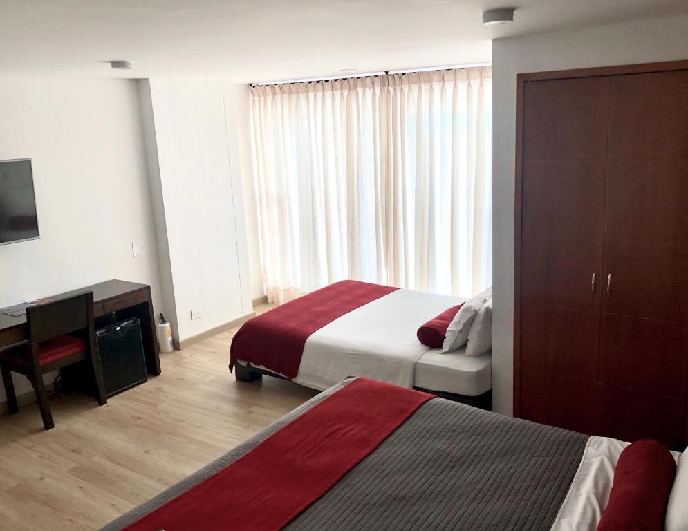 Postel nebo postele na pokoji v ubytování Hotel Florencia Plaza