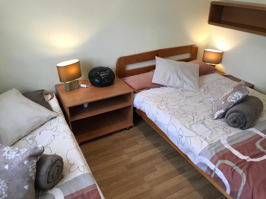 Posteľ alebo postele v izbe v ubytovaní APARTAMENTY-STUDIO noclegi wczasy wakacje ferie - pobyty rodzinne